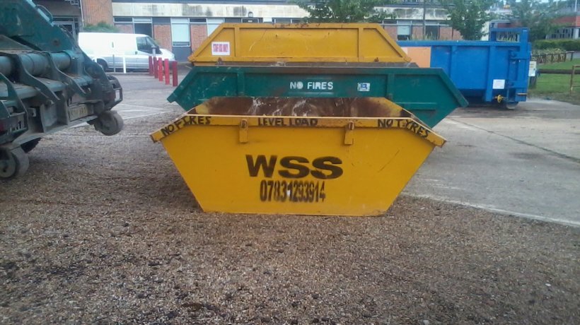Skips at business in Egham